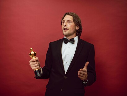 Man celebrating his victory with a cup
