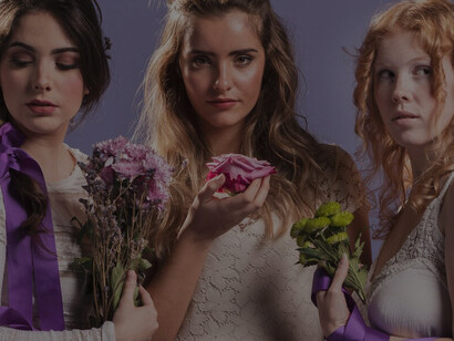 Women radiate beauty while posing with vibrant bouquets of flowers, capturing the essence of nature's elegance