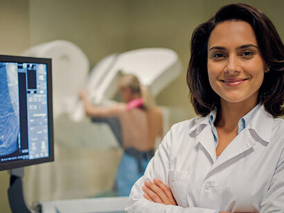Portrait of a female doctor warmly shaking hands with her Hispanic patient after a consultation in her office