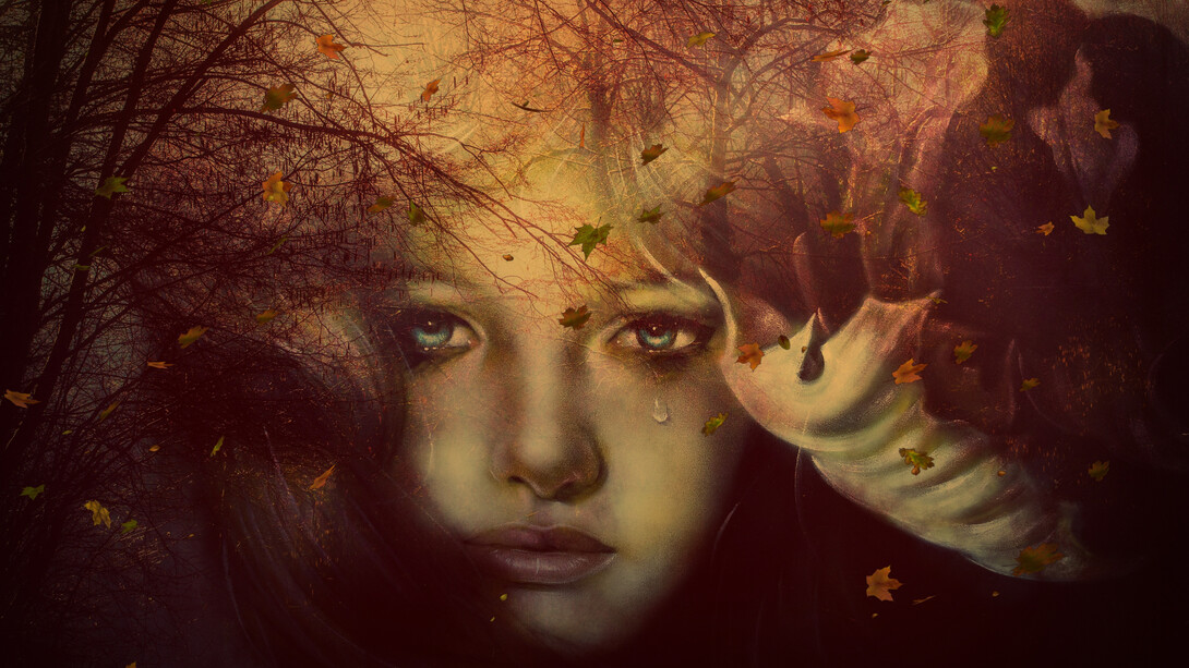 A girl lost in her thoughts is crying 