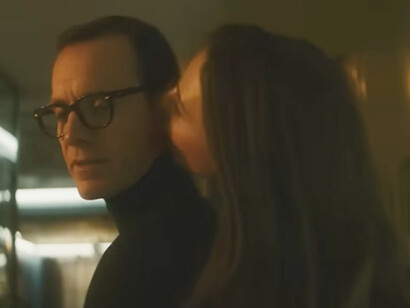 Framed in close quarters and bathed in golden shadow, this quiet touch between spies hints at the love that anchors Black Bag's high-stakes narrative