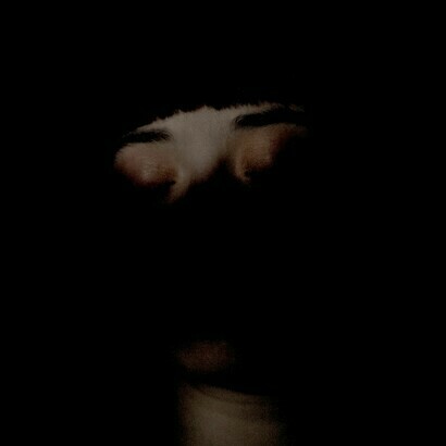Woman hiding her face in the darkness. Every day aporias, perplexities, situations with no way out arise
