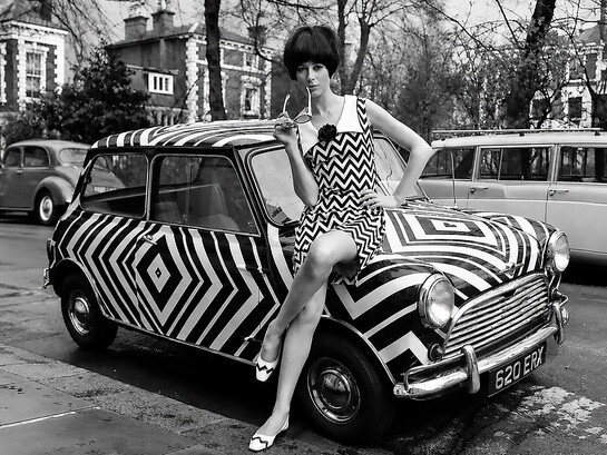 1960s Mod fashion, short for "modernist," was a youth-driven style revolution that emerged from Swinging London. Rejecting the conservative and austere fashions of the 1950s, it embraced bold colour blocking, geometric patterns, sleek shift dresses, miniskirts, and iconic go-go boots, creating a fresh and distinctly modern aesthetic