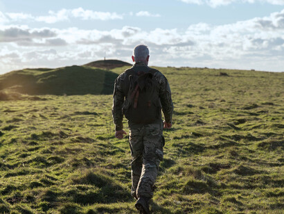A solitary soldier heads into the distance, symbolizing a quiet retreat from foreign entanglements and overstretched ambitions