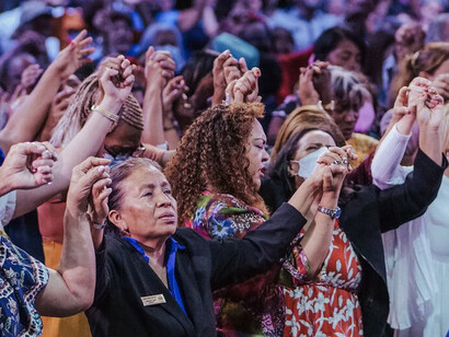 In a moment of unity, worshippers lift their voices in harmony, embodying the profound search for meaning amidst the complexities of modern life