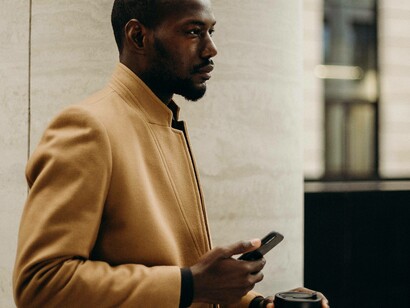 A young African businessman busy on his phone conducting important deals