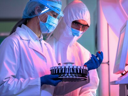 Scientists analyzing biological samples in a laboratory, reflecting the rigorous research behind understanding the composition and safety of human milk