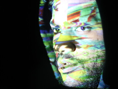 A surreal self-portrait illuminated by glitch projections and mirror reflections, capturing the distorted echoes of our digital age