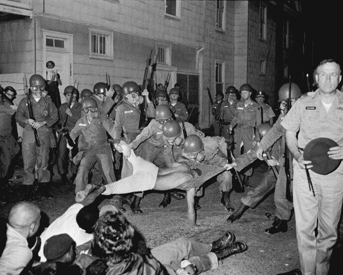 Clifford Vaughs, another SNCC photographer, is arrested by the National Guard, Cambridge, Maryland, 1964. Gelatin silver print, 11 x 14 inches. © Danny Lyon, New York & Magnum Photos, New York / Courtesy Edwynn Houk Gallery, New York.