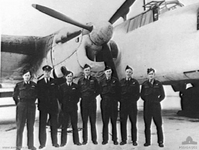 Group of militaries in front of a plane