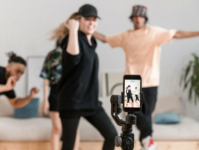 A casual dance performance recorded on a smartphone, symbolizing the simple pleasure of making and sharing videos online