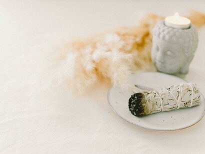 A close up of the sage smoke promotes a meditation moment to uplift the mind in deep relaxation 