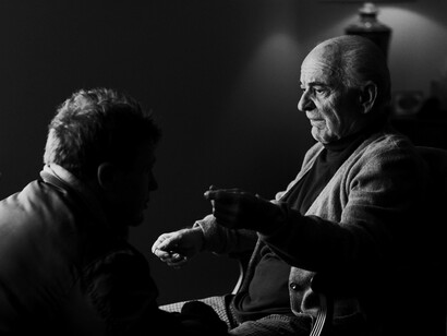 In this poignant scene, the weight of a lifetime of regrets and unspoken words is heavy in the room, as Flannigan, portrayed by Michael Pitt, his raw emotion bringing a quiet, but profound closure to his relationship with his father, portrayed by Joe Pesci