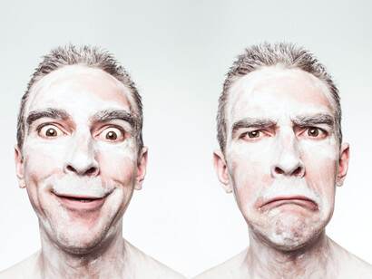 A man with a happy face and a sad face
