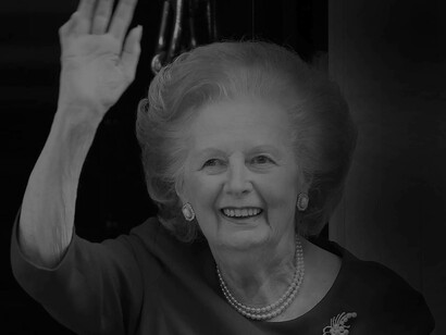 An older Margaret Thatcher former Prime Minister of the UK waving at the crowd