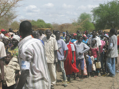 UNHCR staff assist refugees arriving at Doro camp in South Sudan, near the Sudanese border, where nearly 50,000 people have arrived in recent months