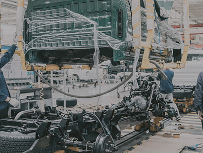 In China, a state-of-the-art automobile factory operates seamlessly, where cutting-edge welding techniques bring vehicles to life with precision and efficiency