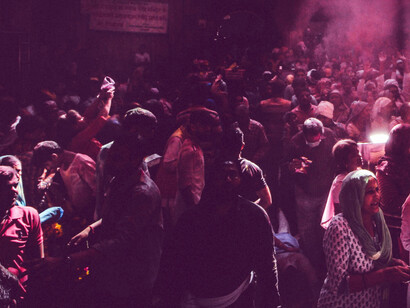 A joyful crowd celebrating the Hindu Holi festival together