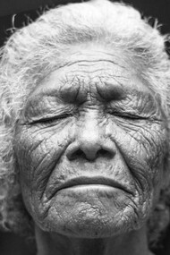A woman breathes deeply as she reflects on her childhood experiences