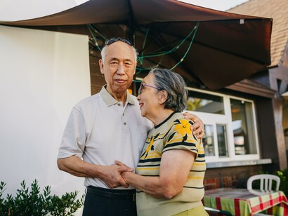 An older couple standing together. Love in older age is the culmination of a lifelong journey