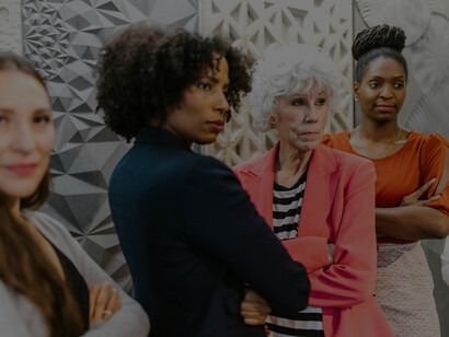 A group of businesswomen gathered for a group photo