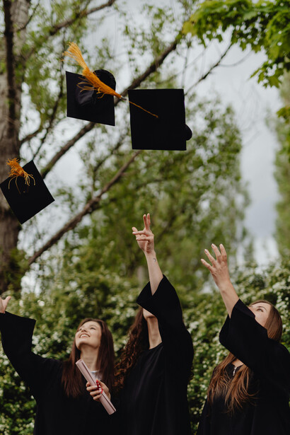 University women graduates celebrating their achievement