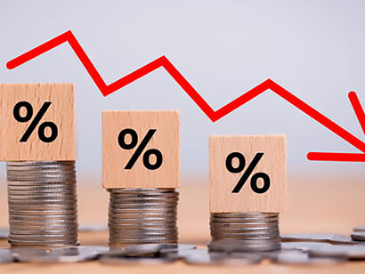 Wooden cubes with percentage sign, stack of coin bar chart, and downward trending red graph on white background symbolizing brand failure