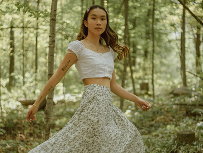 A long haired girl in the woods