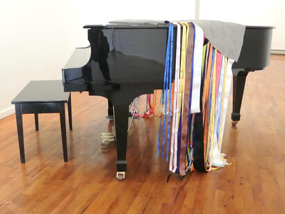 Maria Hupfield, Artist with Silent Noise for Piano. 80 x 70 x 1/4". Felt with satin ribbon. 2015