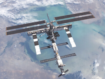 The futuristic world of space exploration with this captivating image of the International Space Station, adorned with solar modules, as it orbits Earth—an awe-inspiring fusion of science fiction and cutting-edge technology