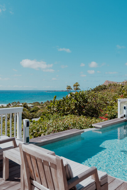 The beach club at Le Toiny Hotel & Beach Club in St. Barthélemy offers a serene setting for sunbathing and water activities