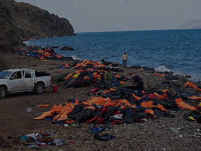 Boat carrying migrants arriving on Lesbos, Greece, illustrating the ongoing Mediterranean migration issue