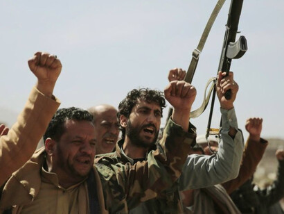 Houthis in Yemen celebrate their show of strength, waving their guns in the air, against a backdrop of escalating regional tensions and global trade uncertainties