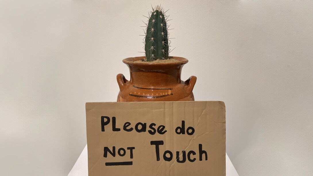 Alejandro Diaz, Please Do Not Touch, 2009, Mexican clay pot, acrylic paint on cast resin sign, live cactus, Pot with plant 10 x 10 x 19 in, 25.4 x 25.4 x 48.26 cm, Pedestal 12x 12 x 48 in, 30.48 x 30.48 x 121.92 cm