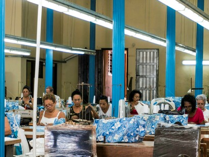 Female migrant workers play a vital role in contributing to factory labor, often shouldering demanding tasks while driving production and supporting economic growth