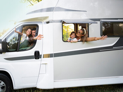 A family enjoying quality time together in their cozy campervan, embracing the joys of van life