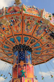 People riding a ride an at amusement park