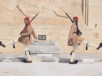 The Evzones execute a precise and ceremonial Changing of the Guard at the Tomb of the Unknown Soldier, situated in Syntagma Square, Athens, Greece