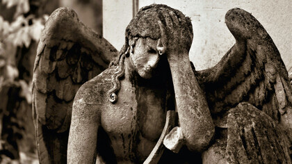 Statue of an angel, full of sadness