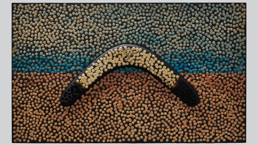 Daniel Boyd, Untitled (AIAFNSCAI), 2023. Oil, watercolor, pencil, found boomerang, and archival glue mounted on wooden panel, 11 3/4 x 19 3/4 in. / 30 x 50 cm. Courtesy of the artist and Marian Goodman Gallery