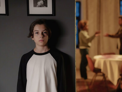 A child quietly observes as his parents engage in a heated argument, exchanging harsh words and negative language