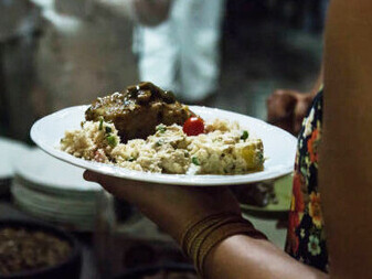 A family savoring street food under the night sky, with girls in Mumbai exploring the city's vibrant food scene