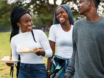 The joy on their faces reflects what staple foods like fufu represent, comfort, identity, and the warmth of shared heritage