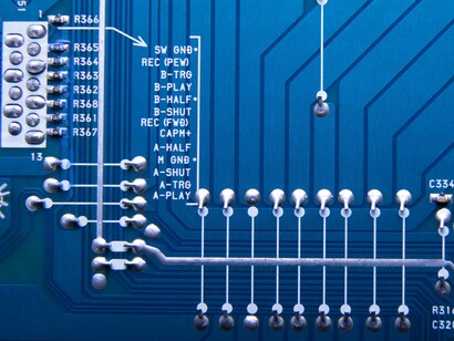 A high-detail circuit board with interconnected components, reflecting the invisible engines behind artificial intelligence and digital innovation