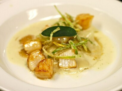 Nantucket Bay Scallops paired with pumpkin ravioli, drizzled with sage brown butter—a delightful nod to the Feast of the Seven Fishes