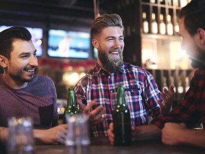 A group of men enjoying a couple of beers