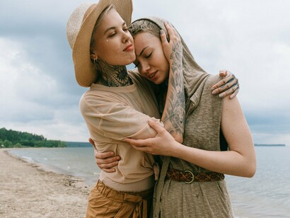 Two people holding each other reassuringly, reflecting the body's gradual release from chronic vigilance