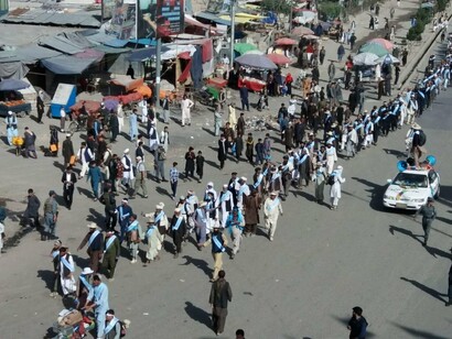 Dozens of men march for peace near Ghazni, on June 2018