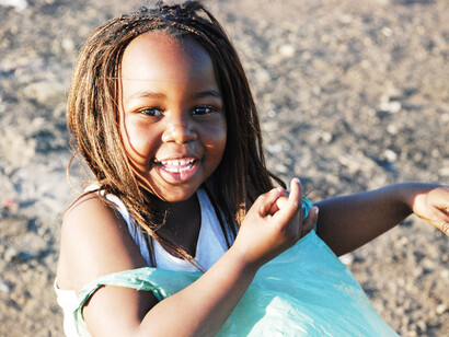 With a bright smile, this young girl embodies the hope and potential of South Africa's next generation