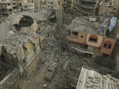 The remnants of destroyed buildings reflect the harsh reality of the Middle East's ongoing wars, as foreign powers and local factions vie for control and influence